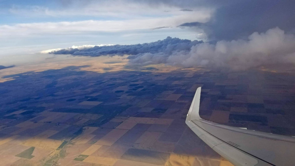 Flying around dark clouds of a storm.