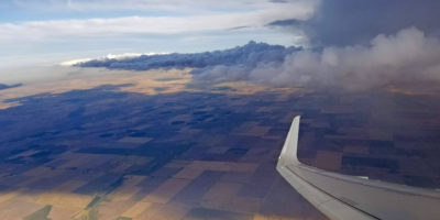 Flying around dark clouds of a storm.